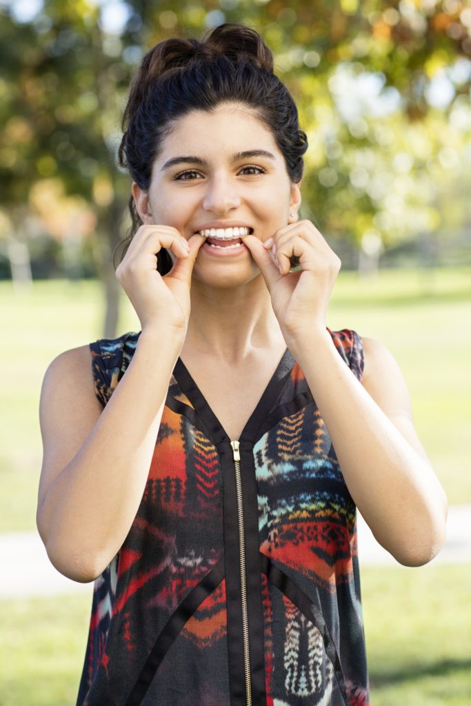 teen with invisalign